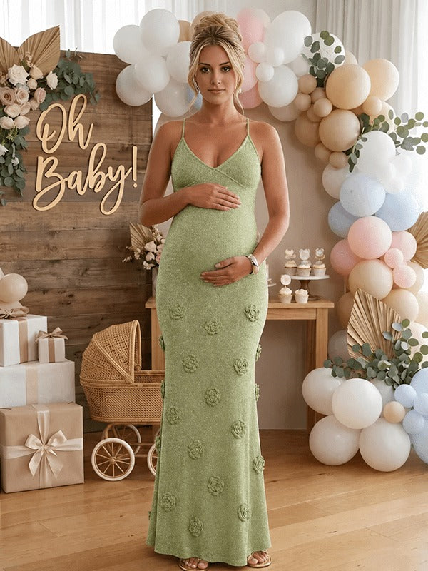 Sage green shimmer knit maternity maxi dress with 3D flowers, cami straps and tie back, designed for maternity photoshoot.