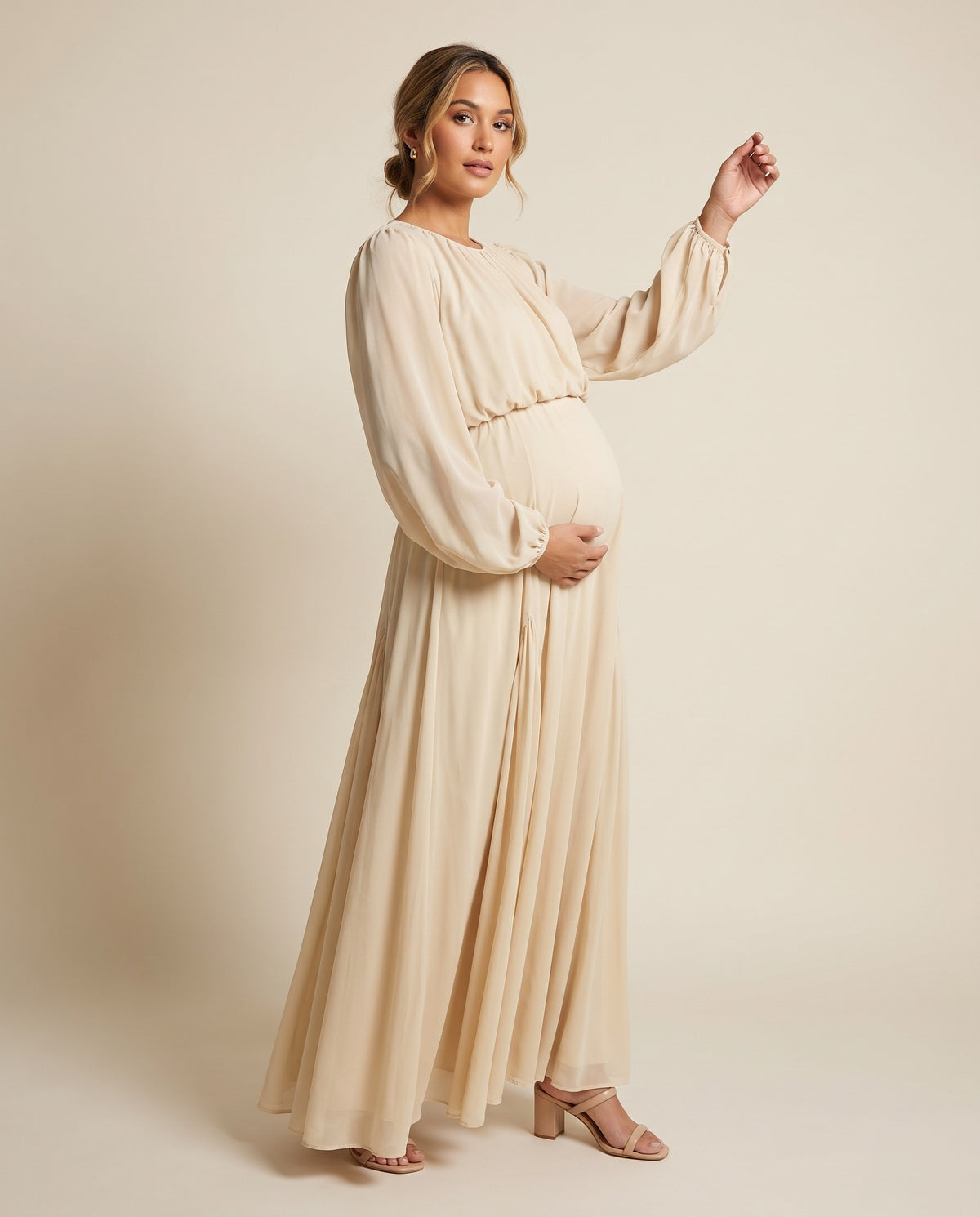 Ivory chiffon maternity maxi dress with balloon sleeves and flowing skirt, designed for baby shower and maternity photoshoots.