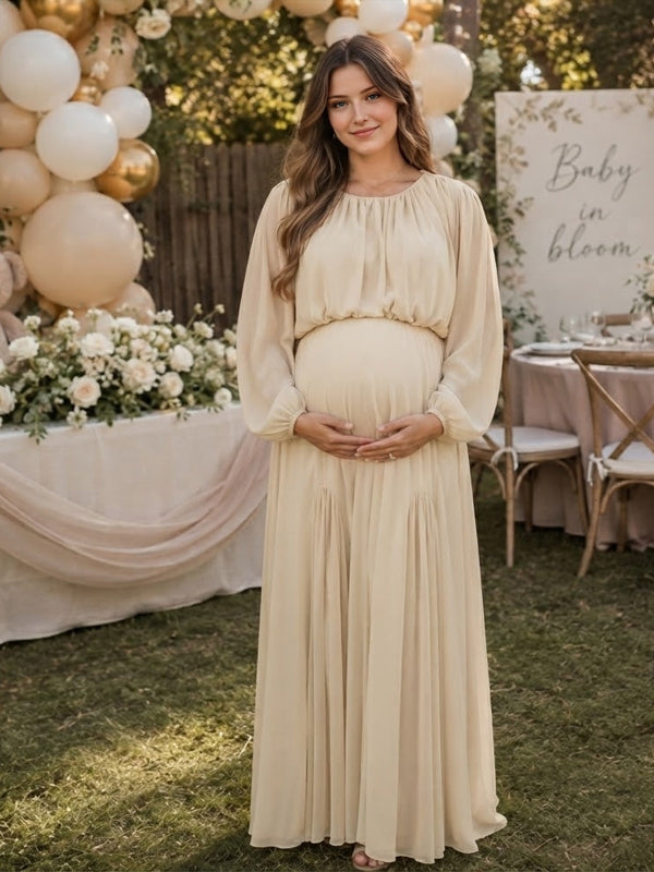 Ivory chiffon maternity maxi dress with gathered neckline, long balloon sleeves and flowing skirt, designed for baby shower.