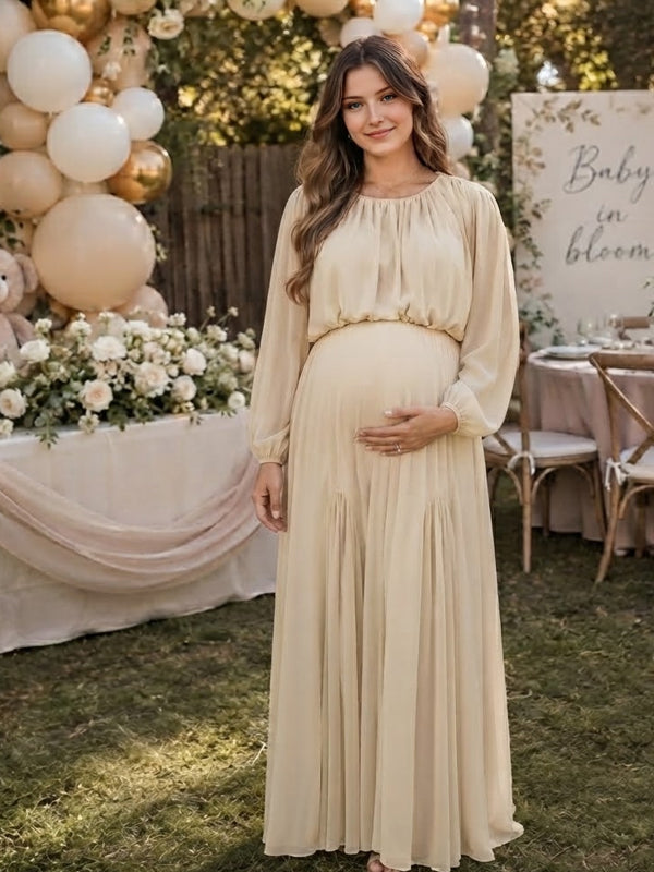 Ivory chiffon maternity maxi dress with gathered neckline, long balloon sleeves and flowing skirt, designed for baby shower.