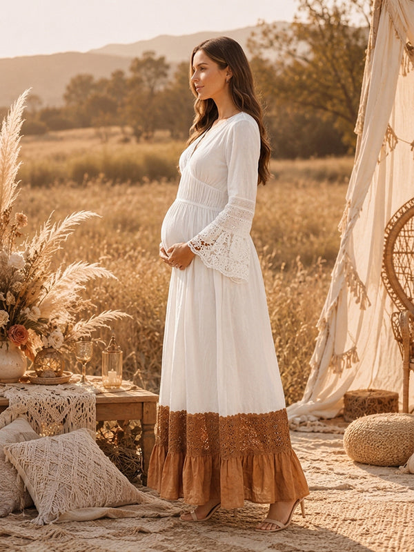 Side view of white boho maternity maxi dress with lace-trimmed V-neck, lace bell sleeves and contrast lace ruffle hem, designed for maternity photoshoot.
