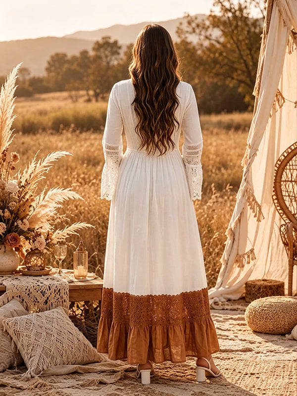 Back view of white boho maternity maxi dress with lace-trimmed V-neck, lace bell sleeves and contrast lace ruffle hem, designed for maternity photoshoot.