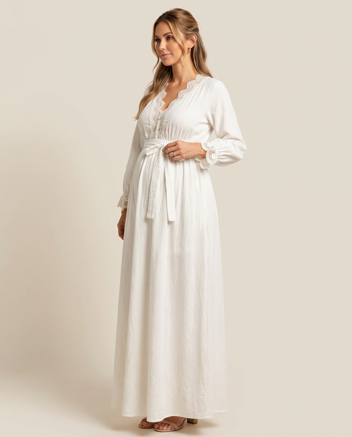 White cotton maternity maxi dress with lace trim neckline and tie waist, designed for boho maternity photoshoots.