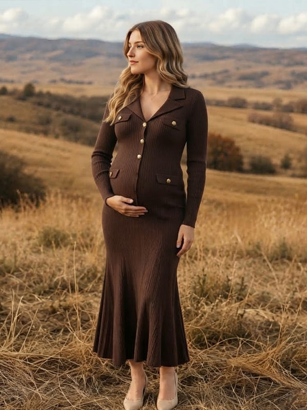 Side view of brown ribbed knit maternity maxi dress with turndown collar, gold buttons and flared hem, designed for maternity photoshoot.