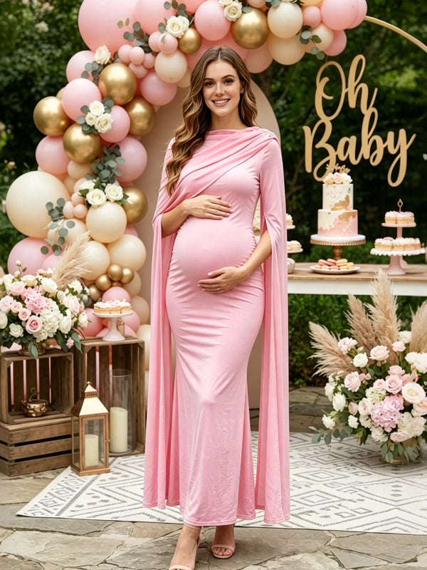 Pink maternity maxi dress with chiffon cape sleeves and fitted body, designed for baby shower.
