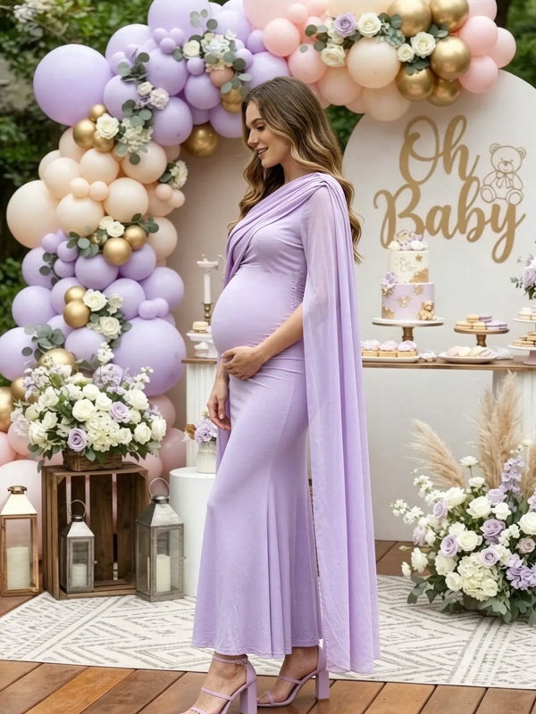 Side view of lavender maternity maxi dress with chiffon cape sleeves and fitted body, designed for baby shower.