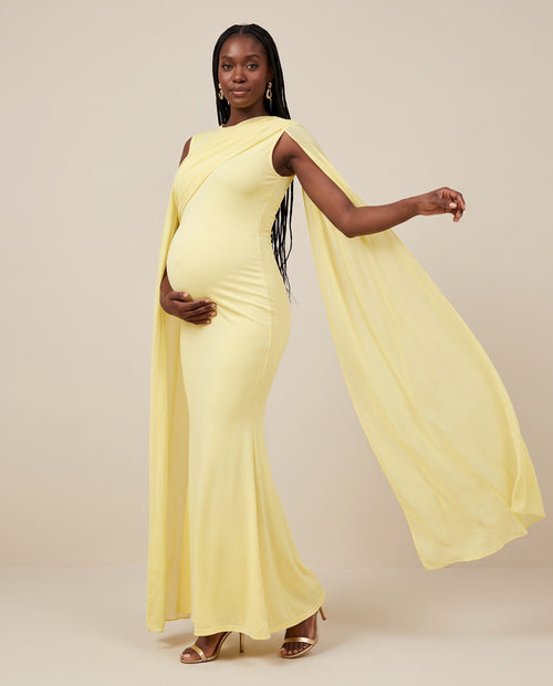 Yellow maternity mermaid gown with sheer chiffon cape, designed for baby showers.