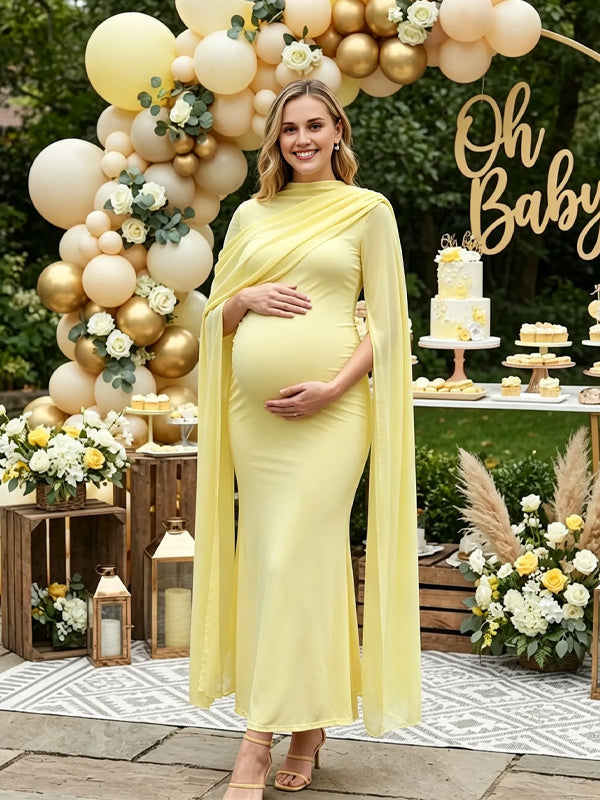 Yellow maternity maxi dress with chiffon cape sleeves and fitted body, designed for baby shower.