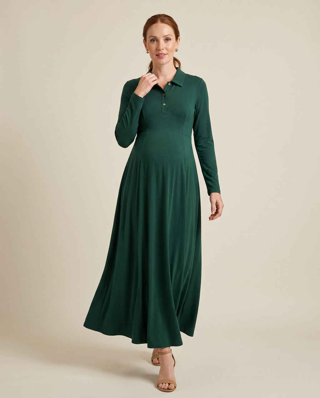 Green jersey maternity maxi dress with shirt collar and button placket, designed for everyday wear.