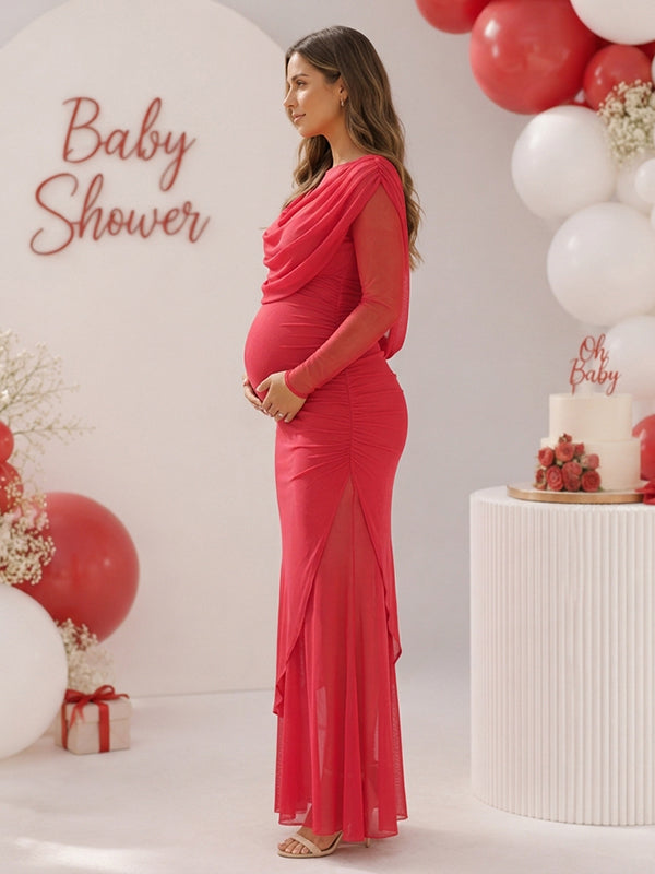 Side view of red mesh maternity maxi dress with draped cowl neck, sheer sleeves and layered hem, designed for baby shower.