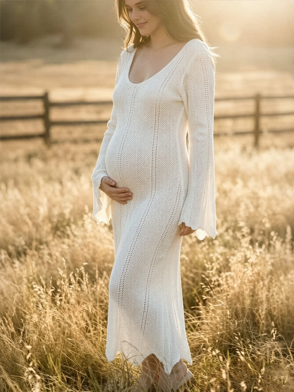 Ivory crochet knit maternity maxi dress with V-neck and flared bell sleeves, designed for maternity photoshoot.
