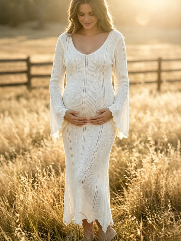 Ivory crochet knit maternity maxi dress with V-neck and flared bell sleeves, designed for maternity photoshoot.