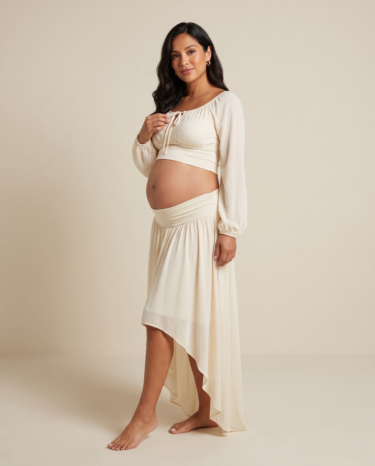 Ivory chiffon maternity two-piece set with cropped top and high-low skirt, designed for beach photoshoots.