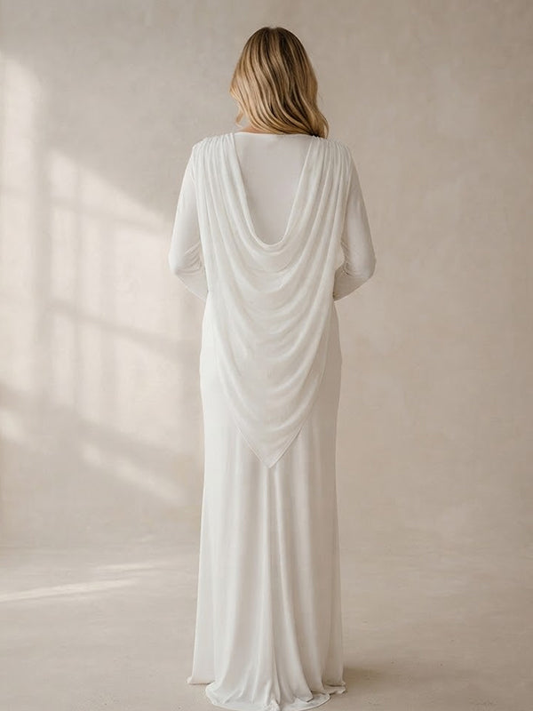 Back view of white jersey maternity maxi dress with draped cape overlay and long sleeves, designed for maternity photoshoot.