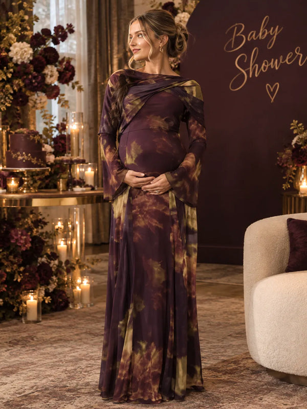 Plum floral print satin maternity maxi dress with draped cape scarf and bell sleeves, designed for baby shower.