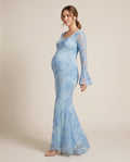 Powder blue embroidered floral mesh maternity maxi dress with bell sleeves, shown on a pregnant model in studio.