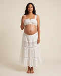 White cotton eyelet maternity two-piece set with crochet lace cami top and tiered skirt, designed for maternity photoshoots.