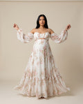 White floral chiffon maternity maxi dress with cold shoulder neckline and balloon sleeves, designed for baby shower and maternity photoshoots.