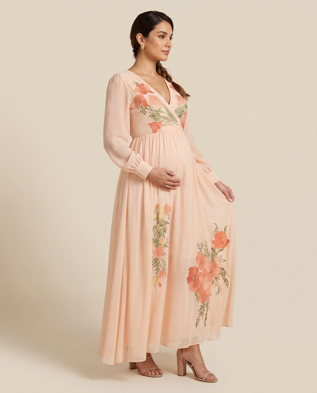 Pink chiffon maternity maxi dress with coral floral embroidery, designed for baby showers.