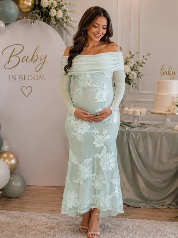 Mint green maternity maxi dress with off-shoulder fold, sheer sleeves and floral embroidery on mesh, designed for baby shower.