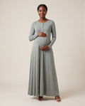 Grey jersey maternity maxi dress with henley button placket and flowing skirt, designed for outdoor maternity photoshoots.