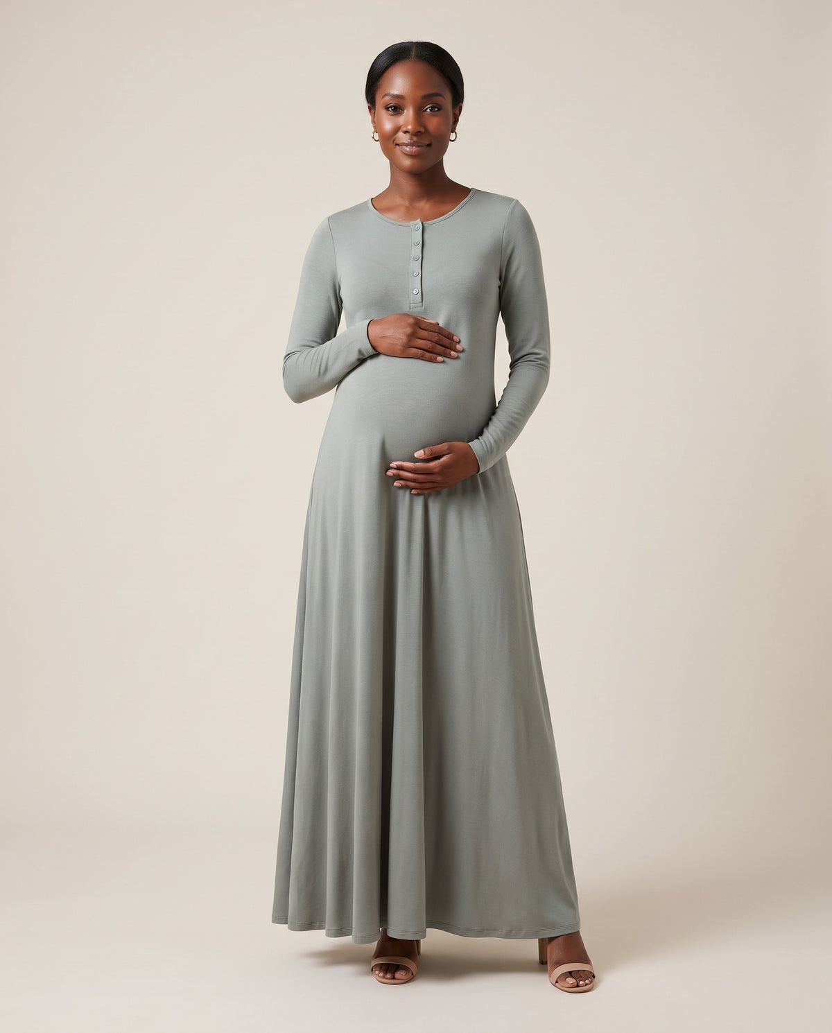 Grey jersey maternity maxi dress with henley button placket and flowing skirt, designed for outdoor maternity photoshoots.