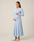 Light blue knit maternity two-piece set with button cardigan and pleated midi skirt, designed for everyday and photoshoot wear.