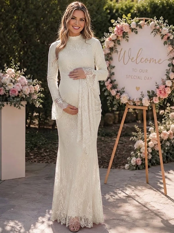 Ivory lace maternity maxi dress with high neck, bell sleeves and draped lace panel, designed for baby shower and wedding.