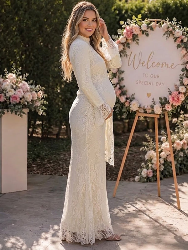 Side view of ivory lace maternity maxi dress with high neck, bell sleeves and draped lace panel, designed for baby shower and wedding.