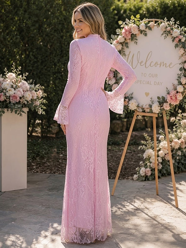 Back view of pink lace maternity maxi dress with high neck, bell sleeves and draped lace panel, designed for baby shower and wedding.