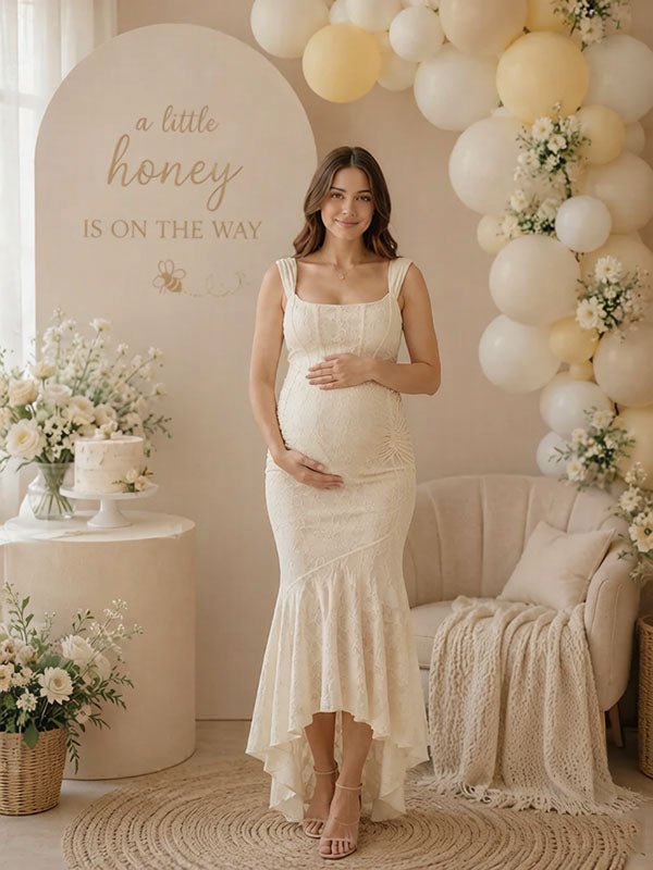 Ivory lace maternity maxi dress with square neck, ruched bodice and high-low ruffle mermaid hem, designed for baby shower.