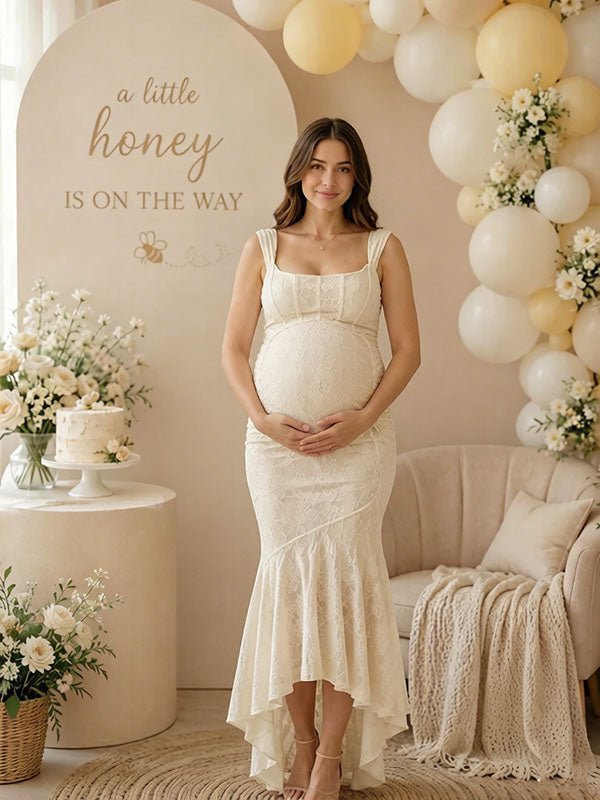Ivory lace maternity maxi dress with square neck, ruched bodice and high-low ruffle mermaid hem, designed for baby shower.