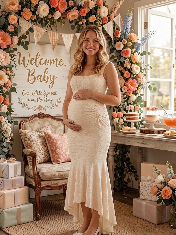 Ivory lace maternity maxi dress with square neck, ruched bodice and high-low ruffle mermaid hem, designed for baby shower.