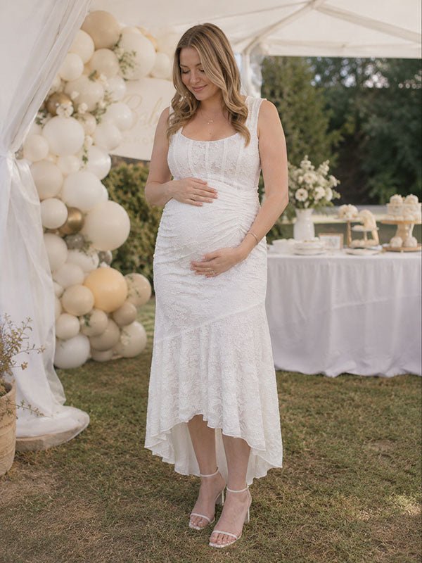Ivory lace maternity maxi dress with square neck, ruched bodice and high-low ruffle mermaid hem, designed for baby shower.
