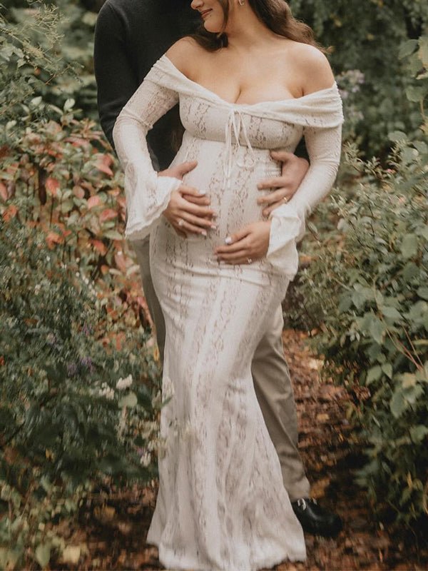 Ivory lace maternity maxi dress with off-shoulder tie-front neckline, bell sleeves and mermaid hem, designed for maternity photoshoot.