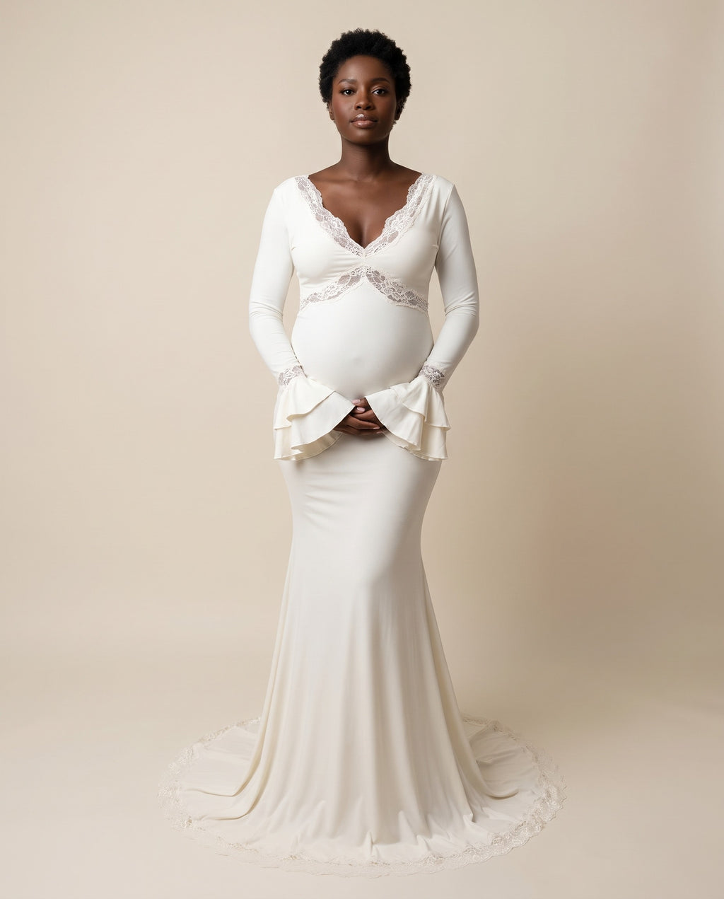 Ivory jersey maternity mermaid dress with lace trim V neckline and ruffle cuffs, designed for maternity photoshoots.