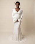 Ivory jersey maternity mermaid dress with lace trim V neckline and ruffle cuffs, designed for maternity photoshoots.