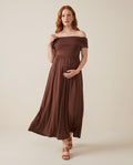 Brown off-shoulder maternity maxi dress with smocked bodice and flowing skirt, designed for baby showers.