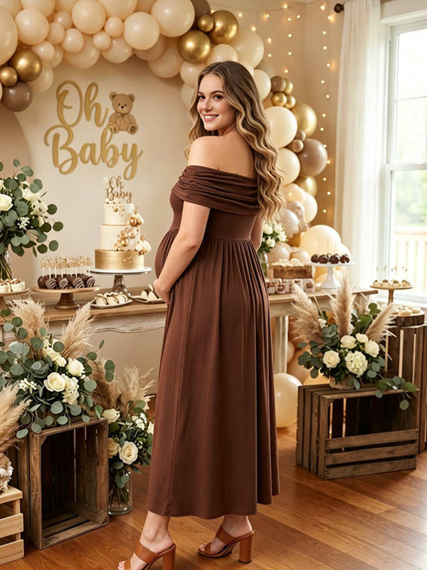 Back view of brown maternity maxi dress with ruched off-shoulder neckline, smocked high waist and flowy skirt, designed for baby shower.