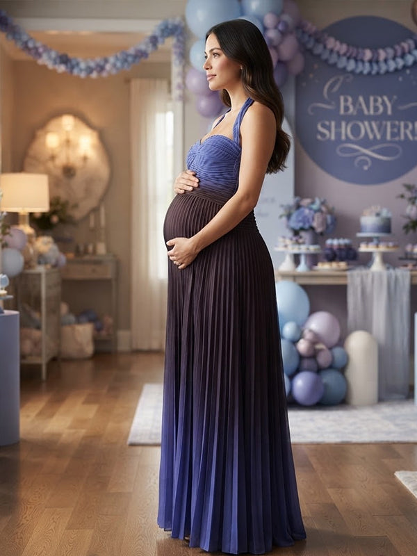Side view of blue ombre pleated chiffon maternity maxi dress with ruched halter sweetheart bodice and open back, designed for baby shower.