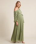 Green pleated one-shoulder maternity maxi dress with ruched sleeve and tie waist, shown on a pregnant model in studio.