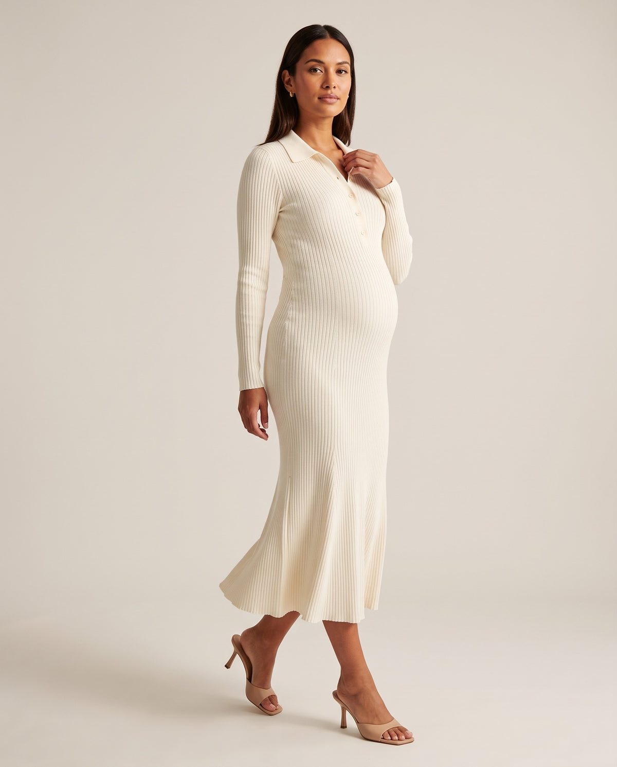 Ivory ribbed knit maternity midi dress with polo collar and button placket, designed for everyday and baby shower wear.