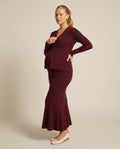 Burgundy rib knit maternity two-piece set with button cardigan and fishtail skirt, designed for photoshoots.