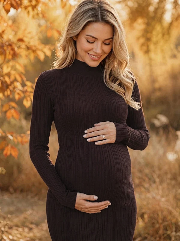 Close-up of coffee ribbed knit maternity midi dress with mock neck, designed for maternity photoshoot.