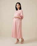 Pink maternity midi dress with rosette cuffs and button front, designed for baby shower and everyday wear.