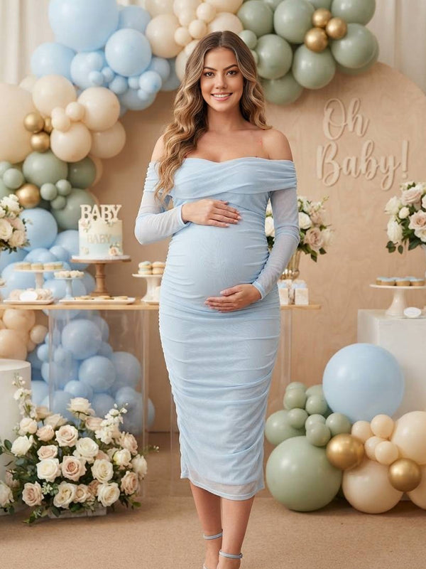 Light blue ruched mesh maternity midi dress with off-shoulder neckline and sheer long sleeves, designed for baby shower.
