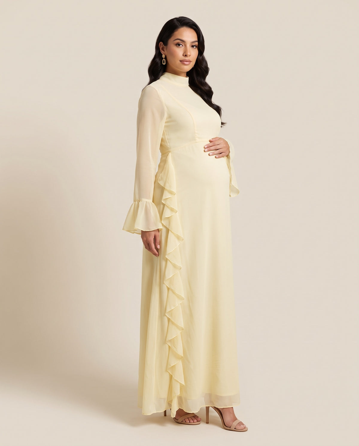 Yellow chiffon maternity maxi dress with cascading ruffle and bell sleeves, designed for baby showers.