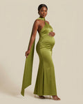 Green satin maternity maxi dress with halter neckline and matching scarf, designed for maternity photoshoots and formal events.