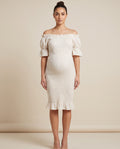 Ivory smocked maternity midi dress with short flutter sleeves and ruffle hem, designed for baby shower and everyday wear.