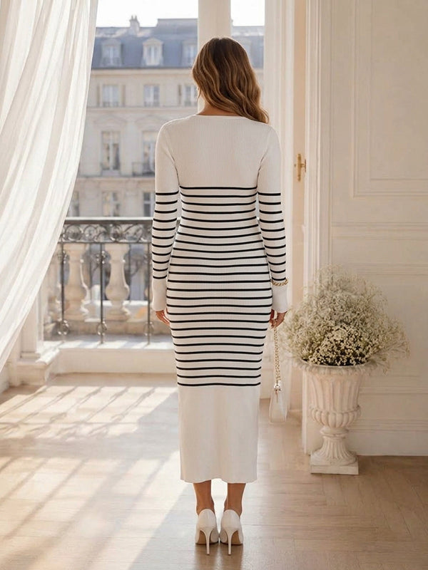 Back view of white and black striped knit maternity midi dress with V-neck and long sleeves, designed for everyday wear.